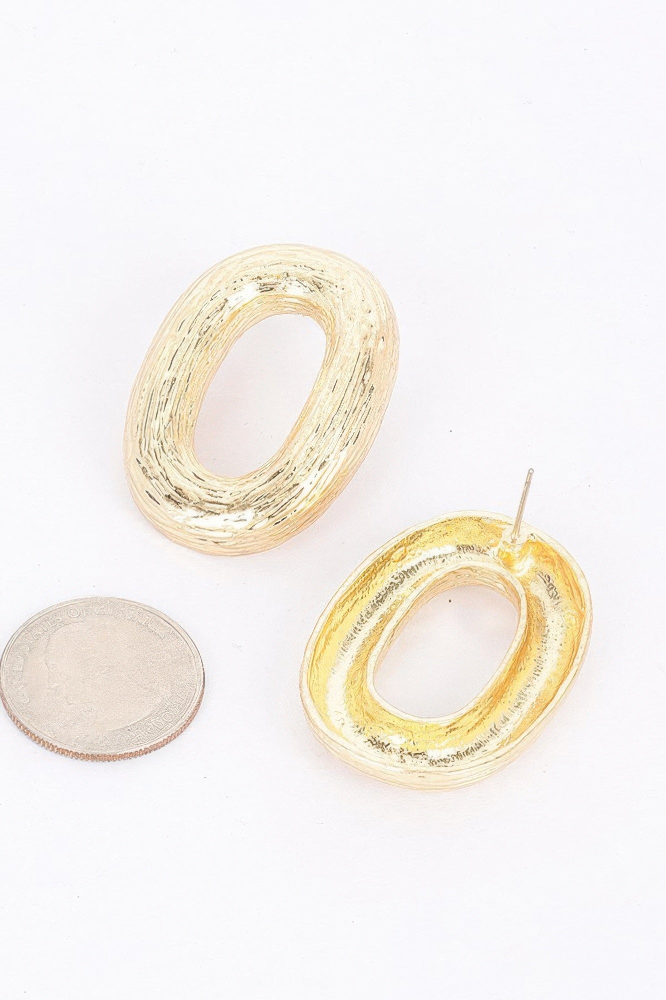 Gold Oval Textured Stud Earrings Secondary image