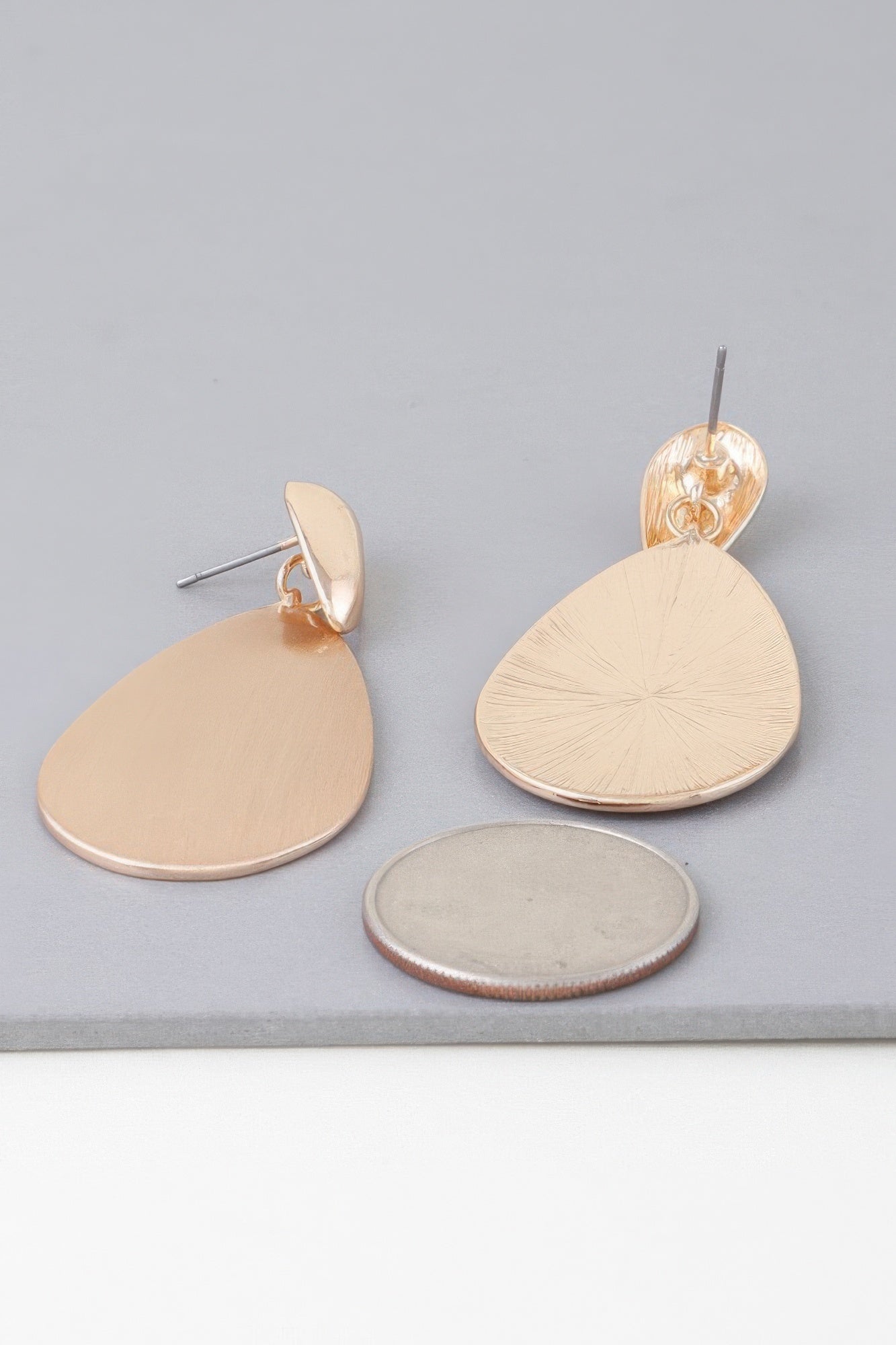 Gold Teardrop Earrings With Sleek Modern Shape Secondary image