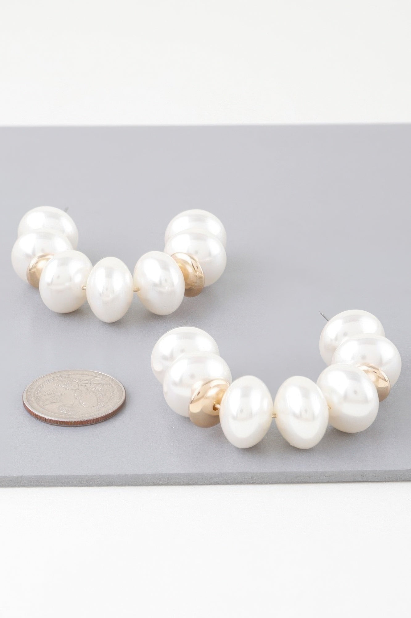 Gold Hoop Earrings With Cream Oval Pearls Secondary image