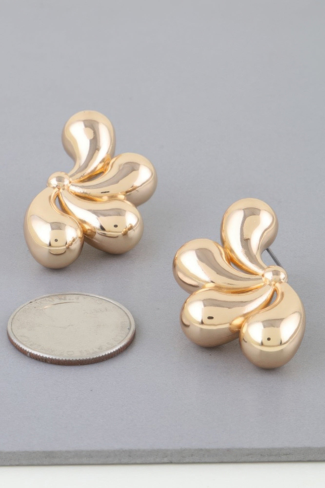 Gold Sculptural Floral Statement Earrings Secondary image