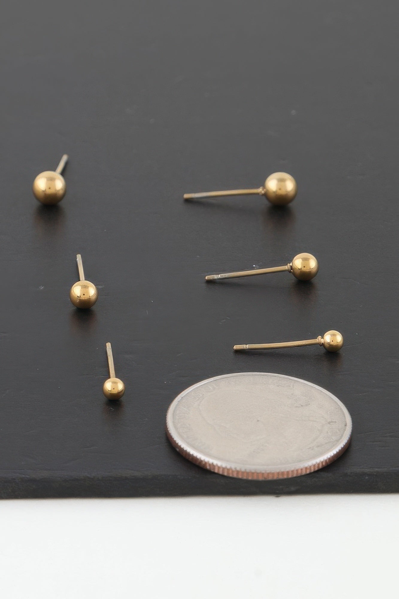 Gold Triple Orb Stud Earrings Secondary image