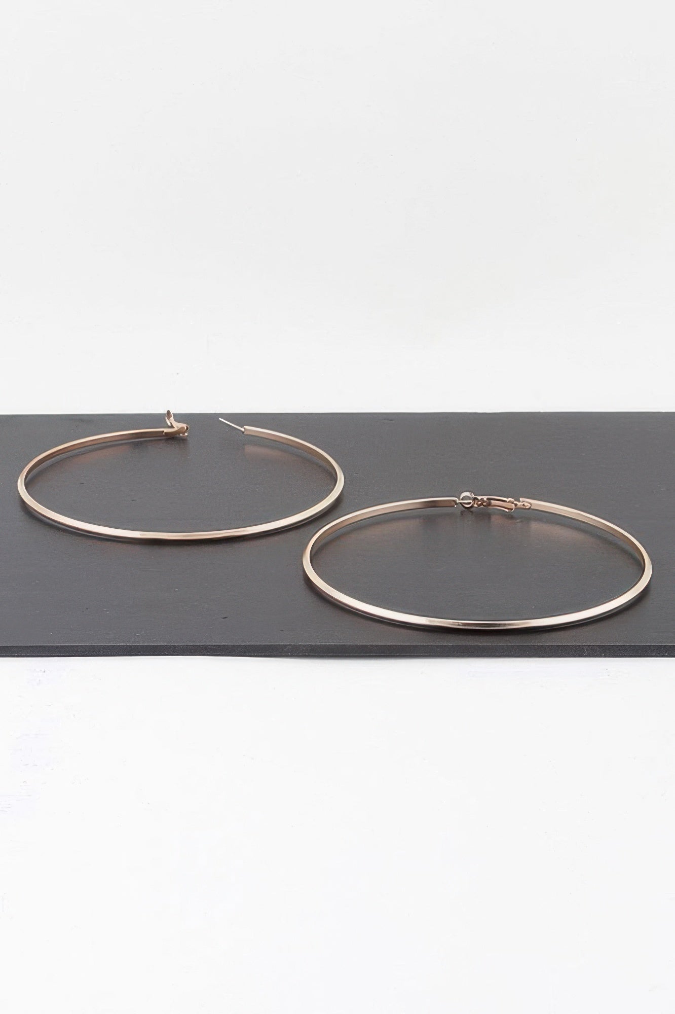 Gold Oversized Polished Hoop Earrings Secondary image