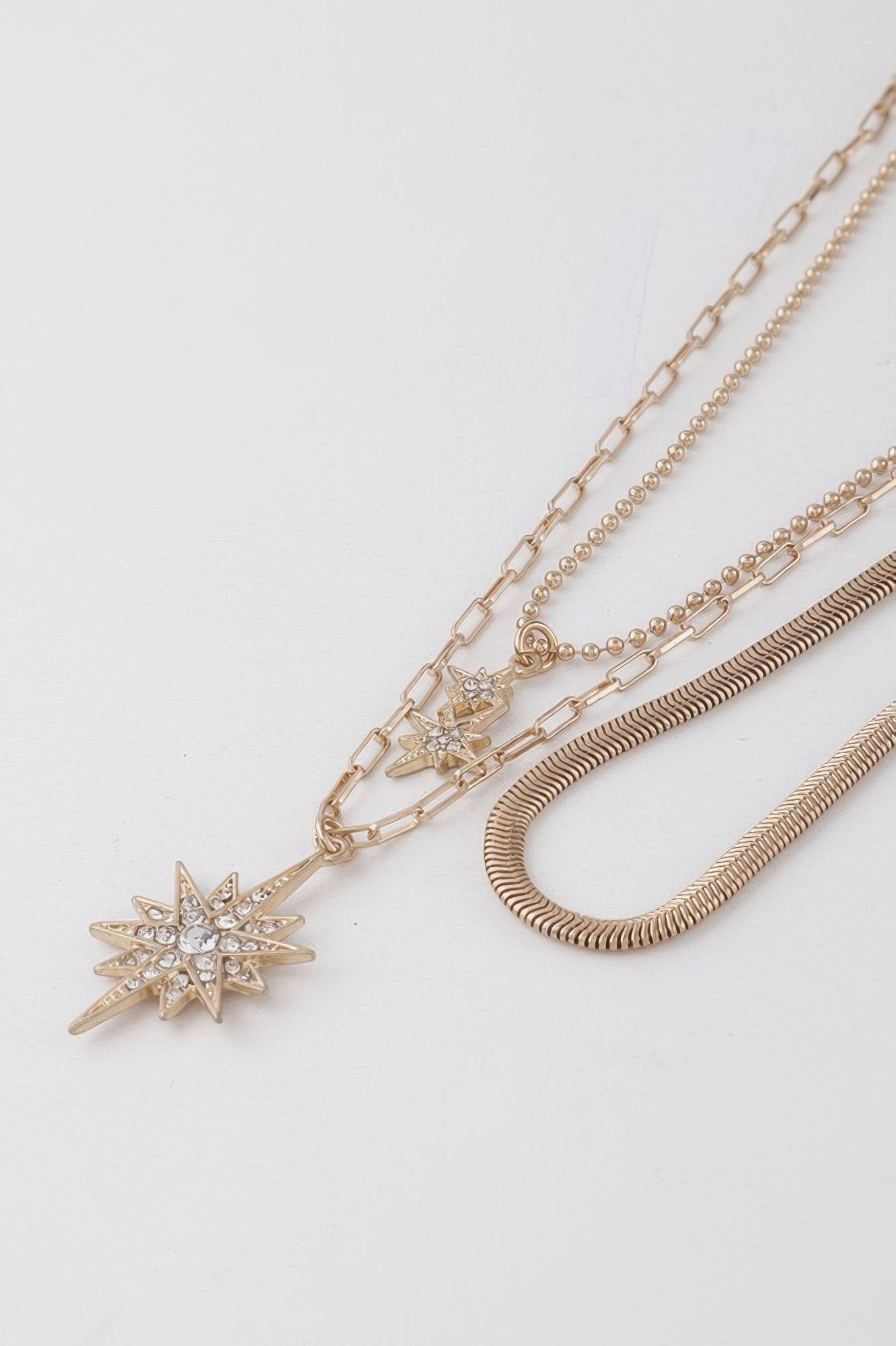 Gold-Tone Layered Star Pendant Necklace Secondary image