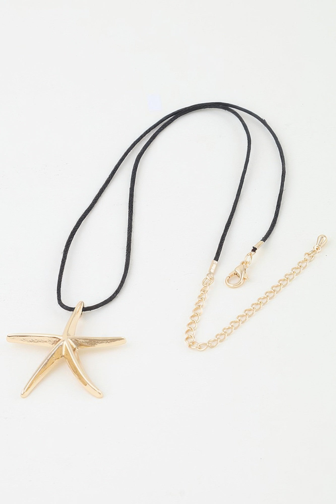 Gold Starfish Pendant Necklace with Black Cord Secondary image